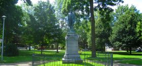 Statue guarded by fence